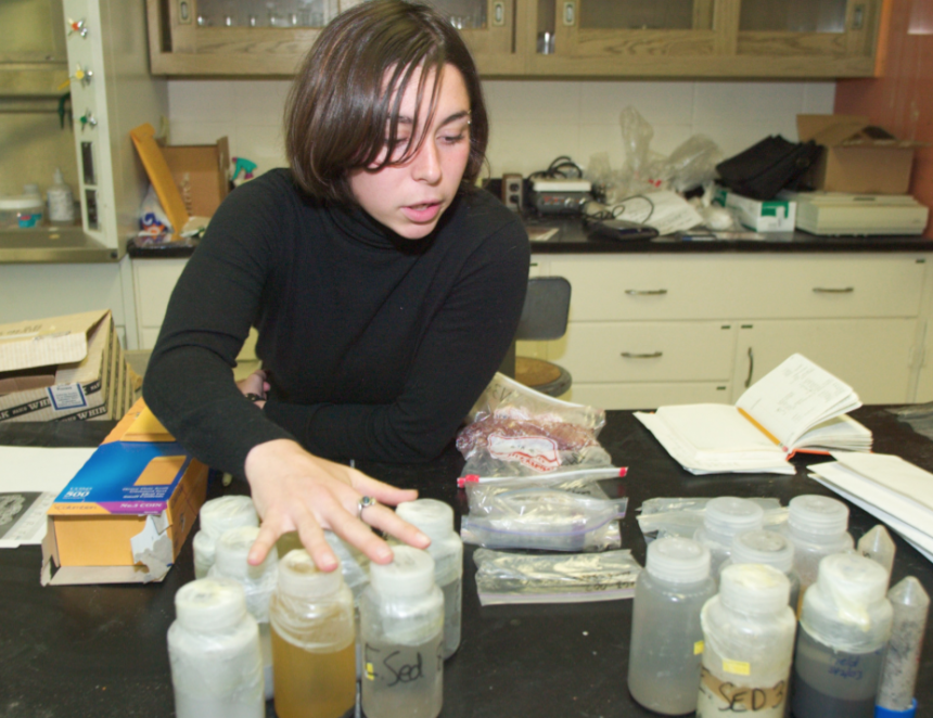 Graduate students assort samples during Kamchatka Geology research.